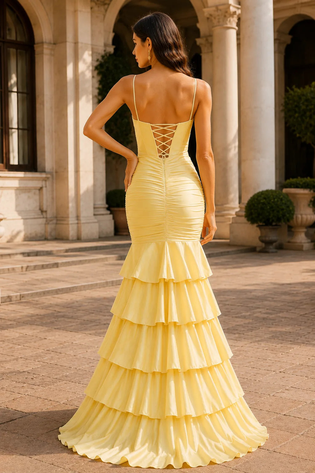 Butter Yellow spaghetti-strap tiered ruffle prom gown with a slit, back view