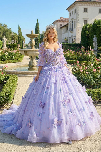 Woman in lavender ball gown with 3D butterfly details and tiara, posing in garden by fountain