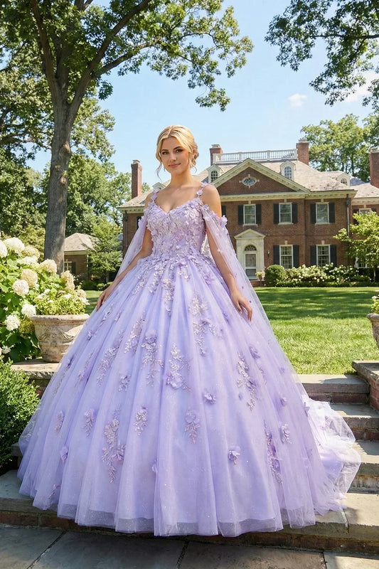 Woman outdoors in lilac ball gown with 3D floral applique and cold shoulder design