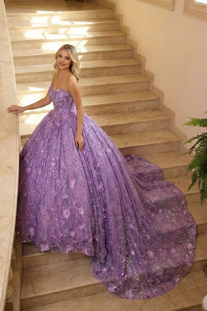 Woman wearing a strapless lavender ball gown with floral embroidery and sequins on marble stairs