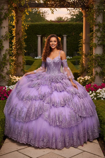Woman in a lavender layered ruffled ball gown with embroidery posing in a garden
