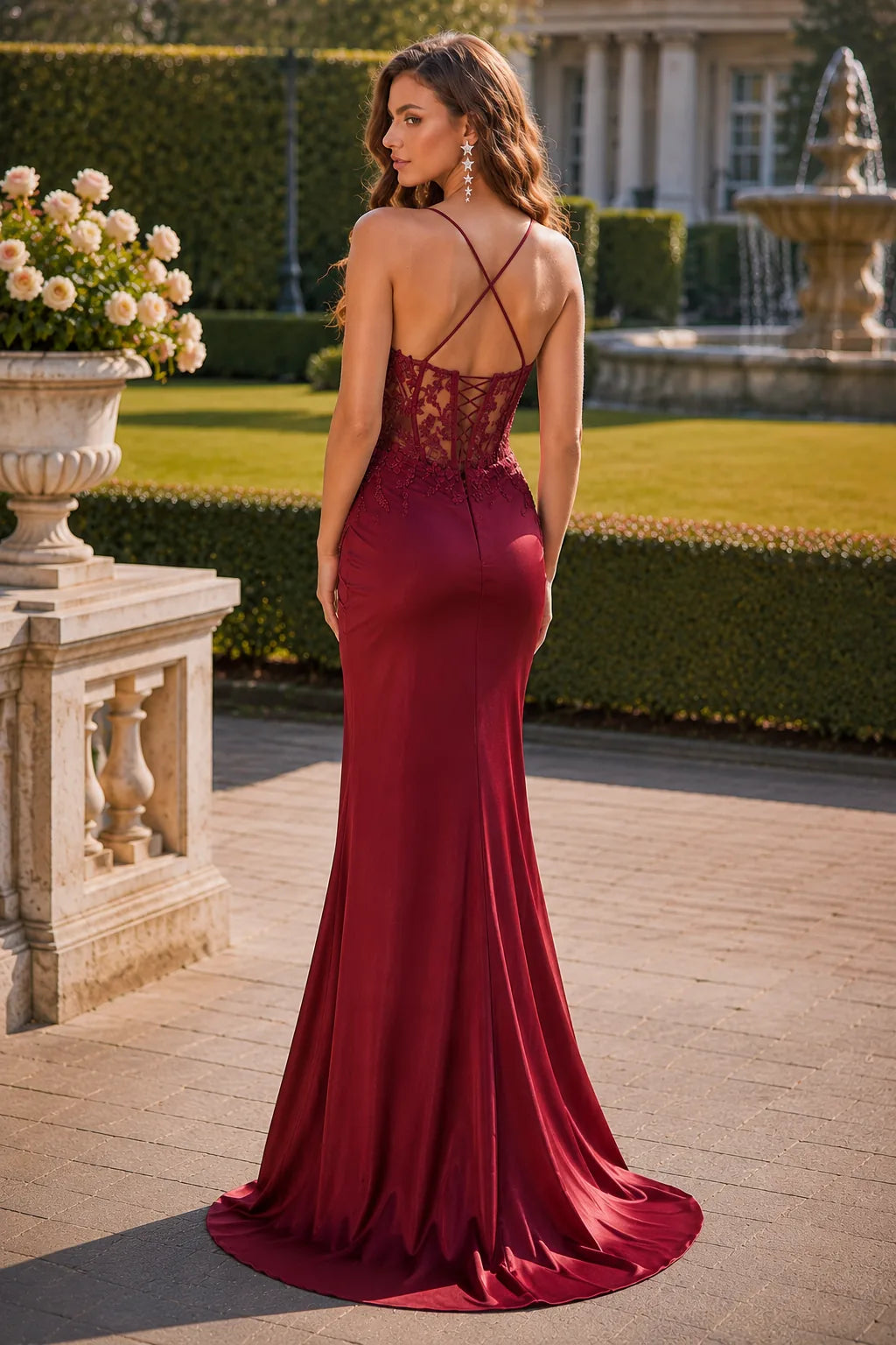 Burgundy embellished-bodice prom gown with a slit, back view