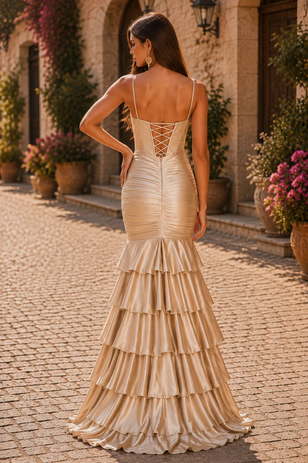 Champagne spaghetti-strap tiered ruffle prom gown with a slit, back view