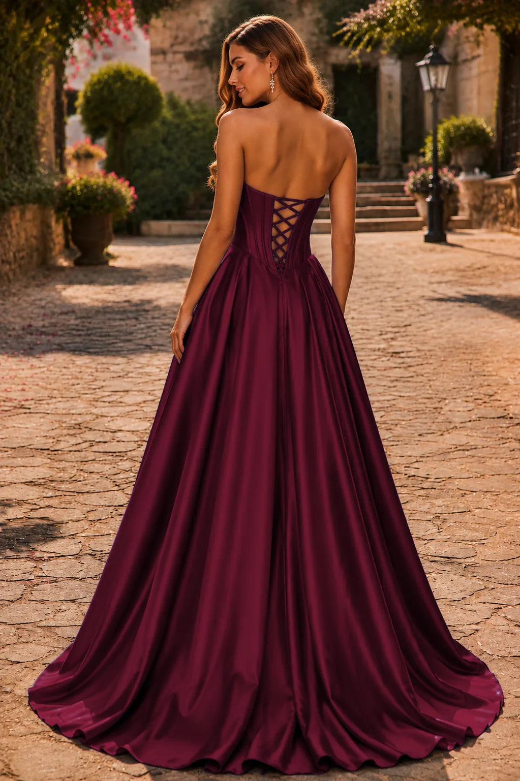 Burgundy strapless corset ball gown, back view